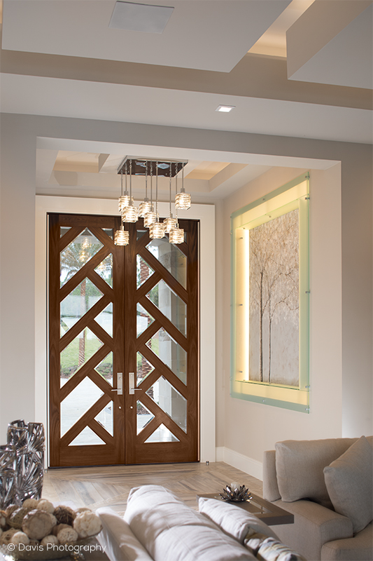 Larger scaled front doors for greater style impact. This modern design by Simpson Door Company was displayed at The New American Home and demonstrates a more interesting way to let light in.